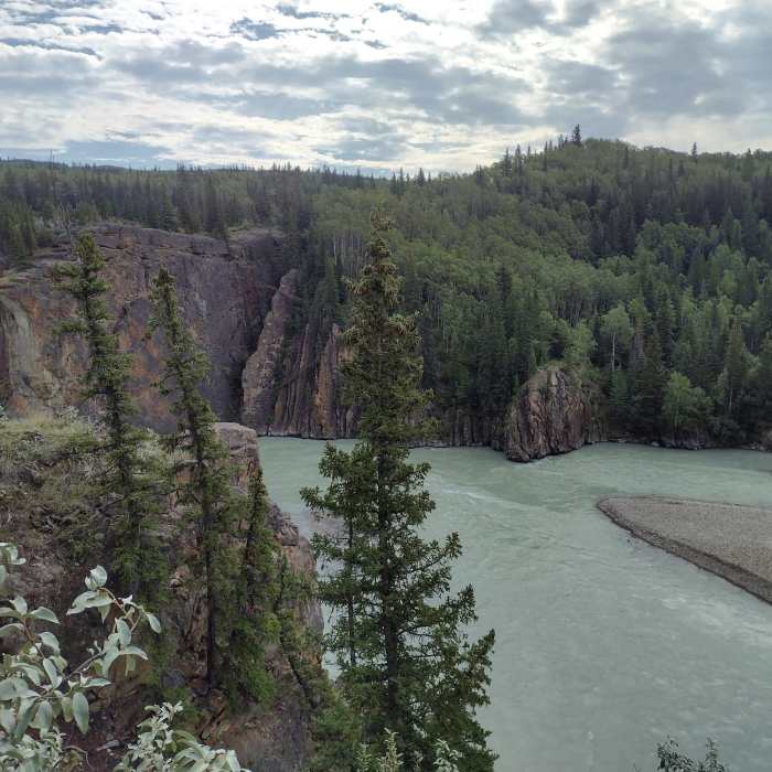 The Smoky River flowing towards the Sulphur Gates cliffs, left-center. Near Eaton Falls