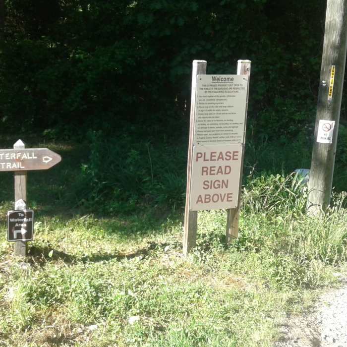 The entrance to the Waterfall Trail is marked by this signage. Near De Hart Botanical Gardens
