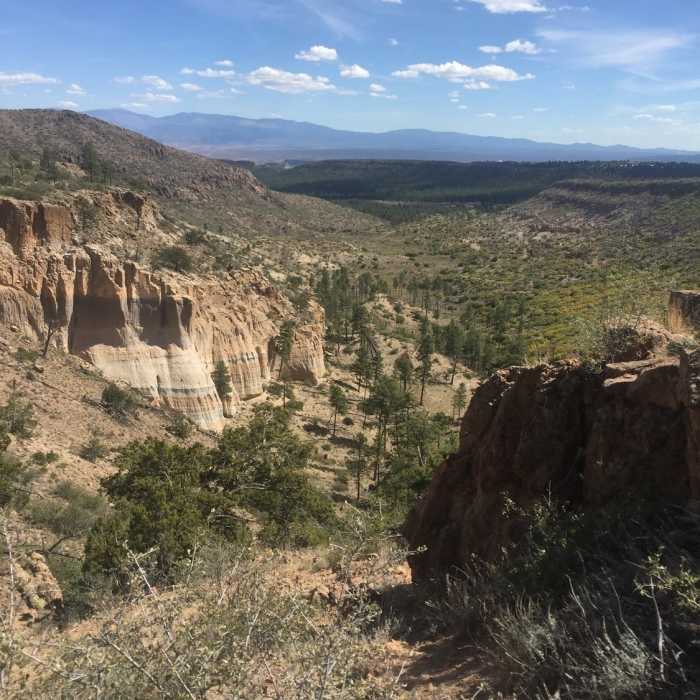 Cliffs with Sangre De Cristo Mountains in the distance. Near Cabra Loop Trail #279