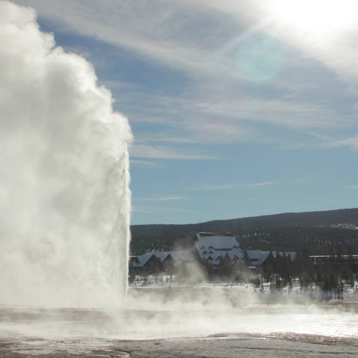 Beehive Geyser, a classic cone-type geyser, erupts a steady column of water through a small vent or geyserite cone. Beehive's cone acts like a nozzle shooting water 200 feet high. Photo courtesy of the National Park Service. Near Upper Geyser Basin Trail