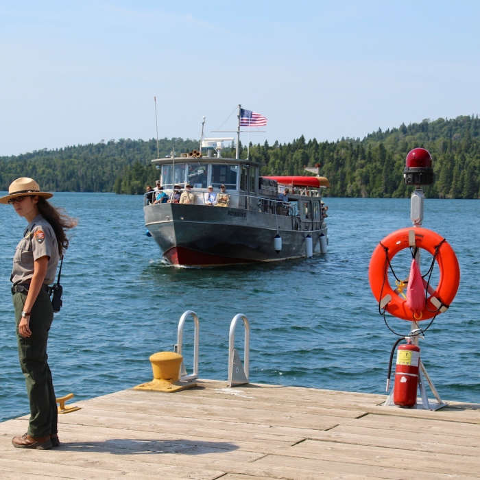 A park ranger awaits the arrival of the ferry at Isle Royale Park. Near Windigo Nature Loop