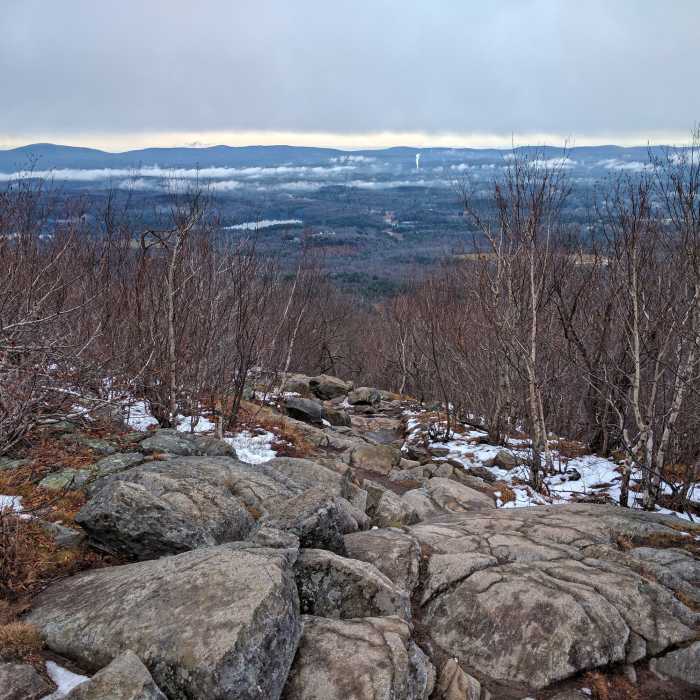 Looking east at the Wapack Ridgeline running along the horizon. Near Monadnock White Cross/Dot Loop
