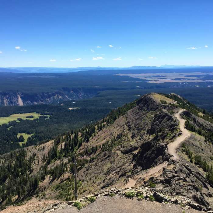 Looking down Mt Washburn trail - Tetons, Hayden Valley, and Yellowstone Gorge in background Near Mount Washburn