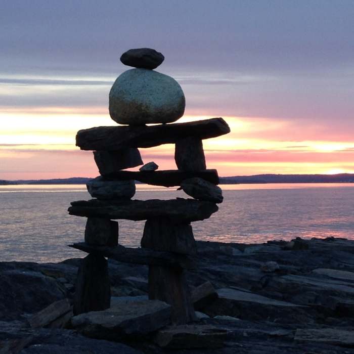 Inukshuk at sunset close to the William F. Schwartz Memorial Point along the Gaff Point Trail. Near Gaff Point Trail