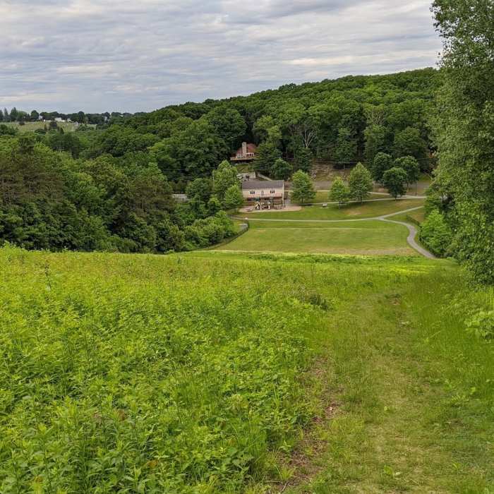 View down the hill and across to the cemetery on the next hill over. Near Jericho Hill Red, White & Blue route