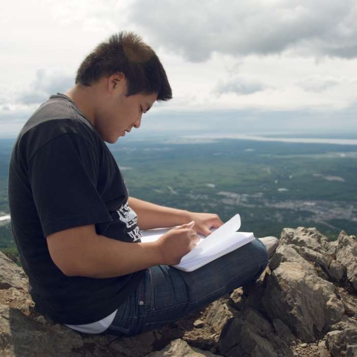 Signing the summit journal of Mt. Baldy. Near Mt. Baldy Trail