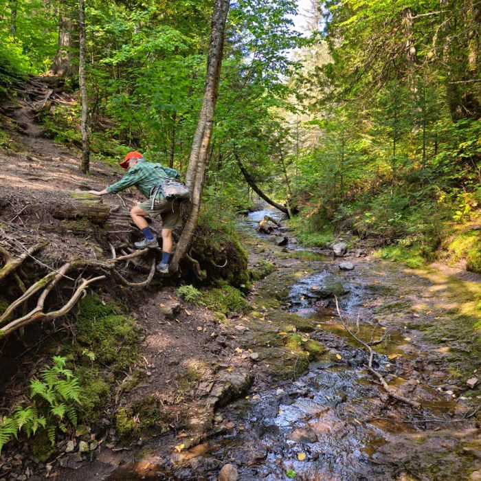 Crossing an unbridge drainage along the trail. Near Cascade River Loop