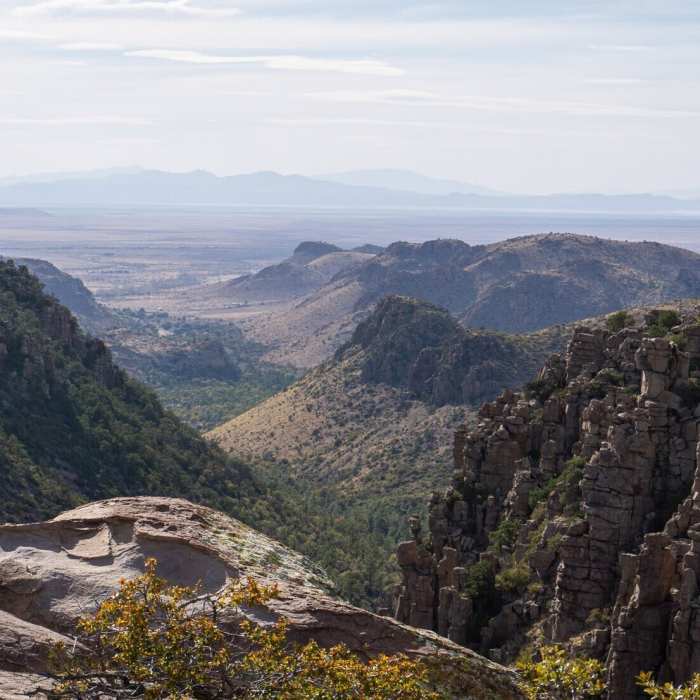 A hiker looking out from the edge of the Chiricahua Mountains. Near Echo Canyon Trail