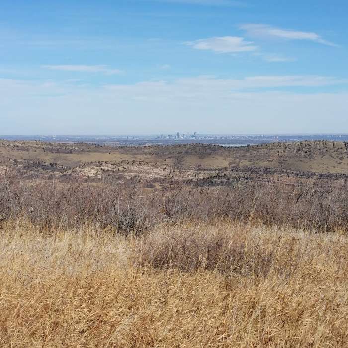 Enjoy spectacular views of a distant downtown Denver from the Meadowlark Trail. Near Meadowlark Trail