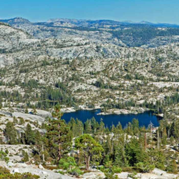 Flora Lake from below Kibbie Mountain. Hike down the smooth granite to the lake, and then hike up the shallow canyon that goes across the left side of the picture towards Nance Peak. Near Flora Lake - Boundary Lake Route