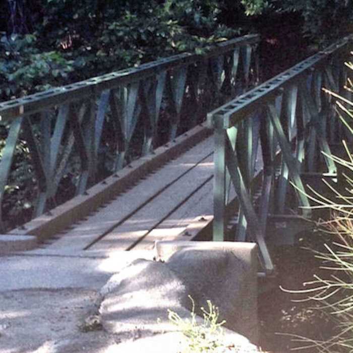 Foot bridge at Robert's Camp. Cross the bridge or head through the creek and start the climb up the paved fireroad to the Chantry Flat parking lot. Near First Water #11W14.B