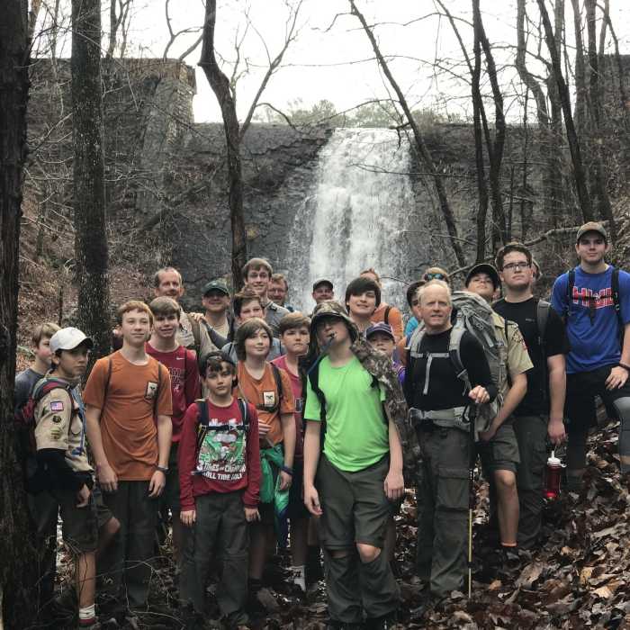 A scout group poses for a photo at the spillway. Near Oak Mountain 20 Miler