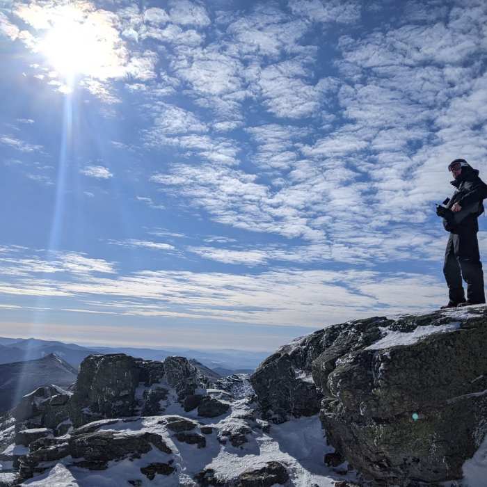 Braving chilly winds for the view between Lincoln and Lafayette. Near Franconia Ridge Loop