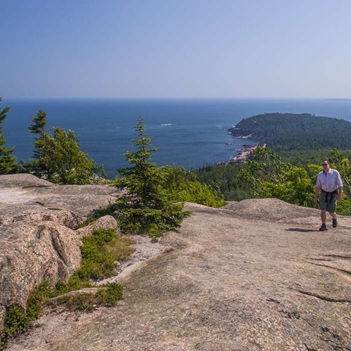 Hiking up Gorham Mountain with Otter Cliffs below. Near Gorham Mountain Trail