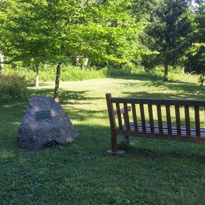 Traveling from north to south, this is the view of the Beach memorial. Trail continues across the clearing. Near Perimeter Loop