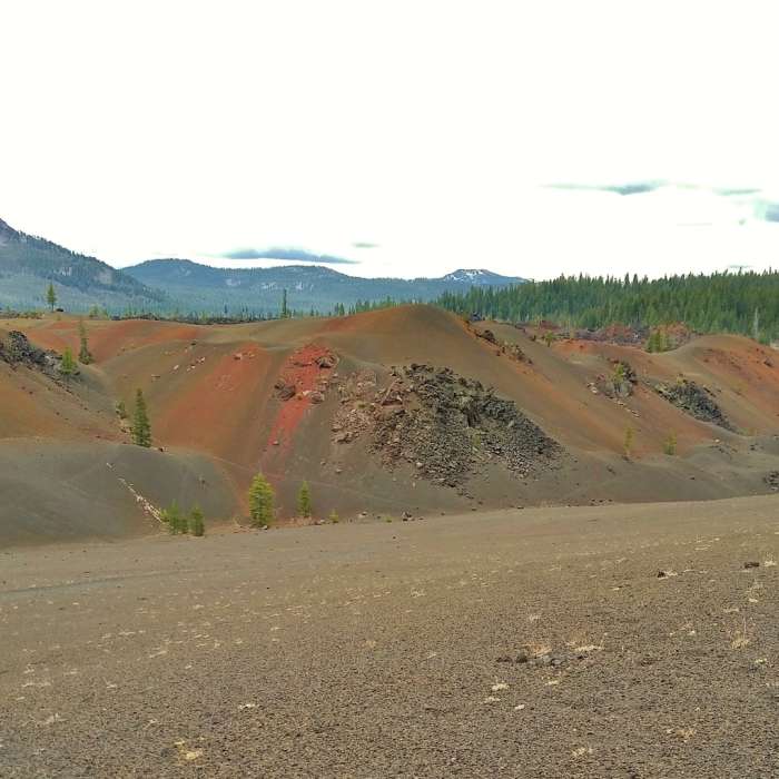 Painted Dunes on the southeast side of Cinder Cone, seen from Nobles Emigrant Trail (East). In the distance to the southeast is Mt. Hoffman, 7,833 ft. Near Cinder Cone Trail