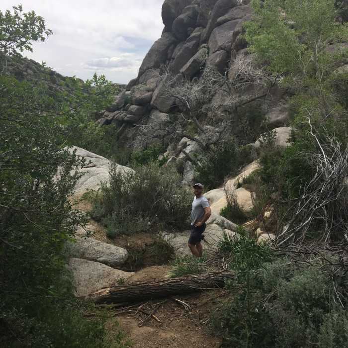 Admiring the giant rocks in the dry river bed. Near Embudo Horse Trail