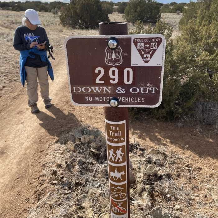 Trail sign Near Placitas loop: Down and Out to Red Tail to Prickly Pear