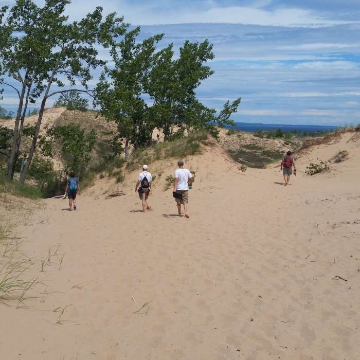 Hiking over sand to Lake Michigan Near Dunes Trail