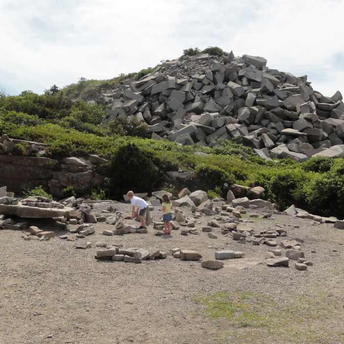 Kids playing by the rock pile at Halibut Point Near Halibut Point Loop