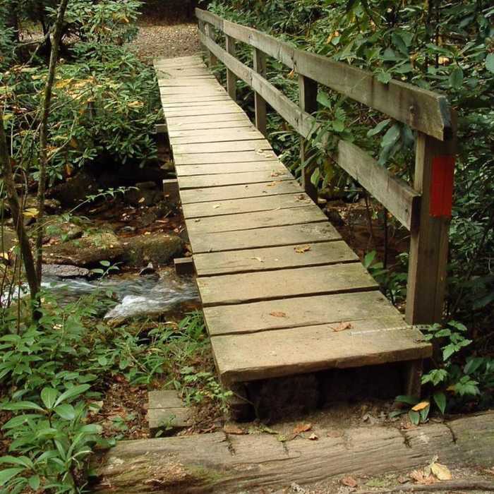 A sturdy bridge aids your passage over Grogan Creek. Near John Rock Loop