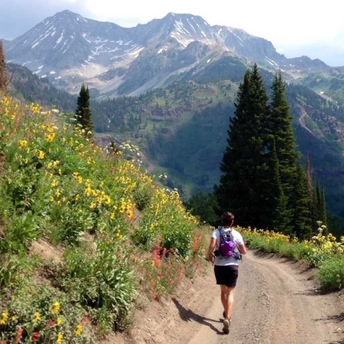 Michelle takes in views of Snowmass Mountain during the spectacular descent into the Lead King Basin. Near Snowmass Mountain West Slope