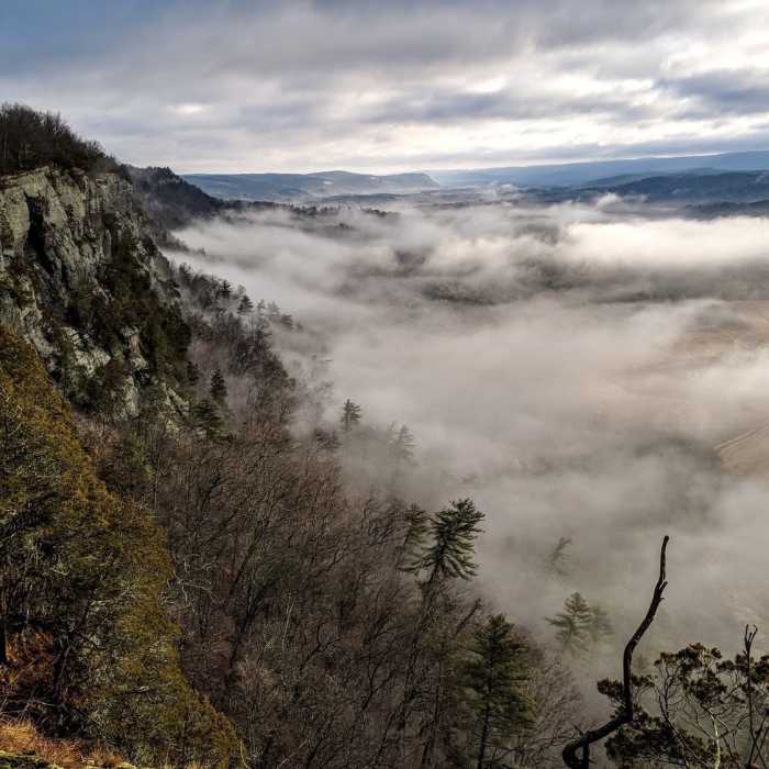 The fog is beginning to lift along side these craggy ledges in Cliff Park, Pennsylvania Near Cliff Park Loop