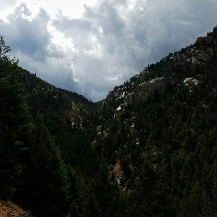 Beautiful view of waterfall and rocky terrain glistening after rainfall. Near Bear Creek Trail (#666)