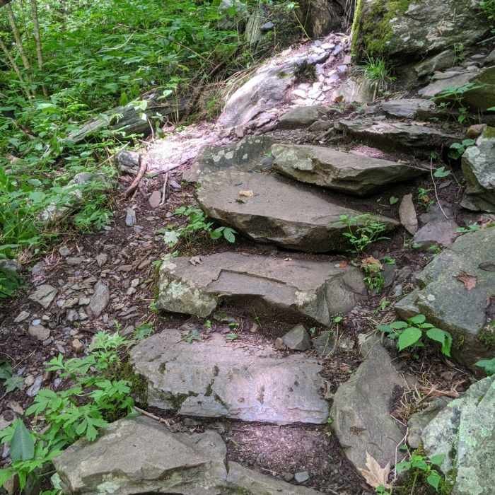 Narrow stone step path between end of South River Falls Road and the base of the falls. Near South River Falls Road