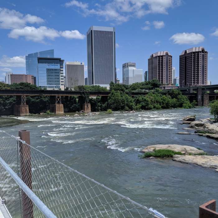 James River rapids and skyline from trail bridge. Near James River Loop