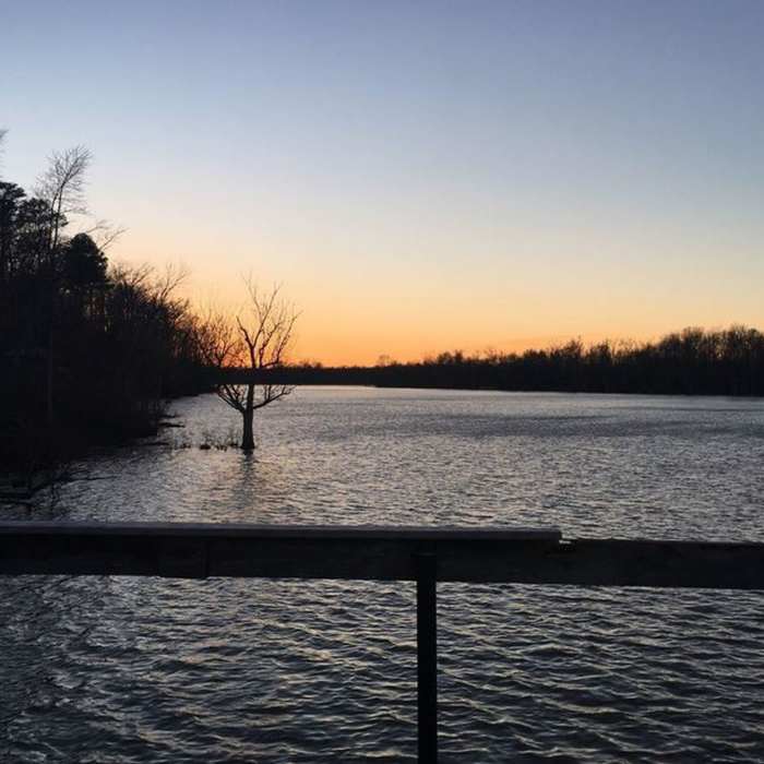 The sun sets over the Appomattox River. Near Appomattox River Park Loop