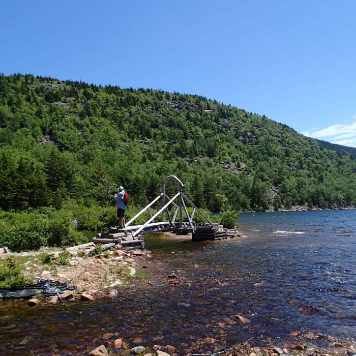 A small bridge aids your passage over the water near the north end of Jordan Pond. Near Deer Brook Trail