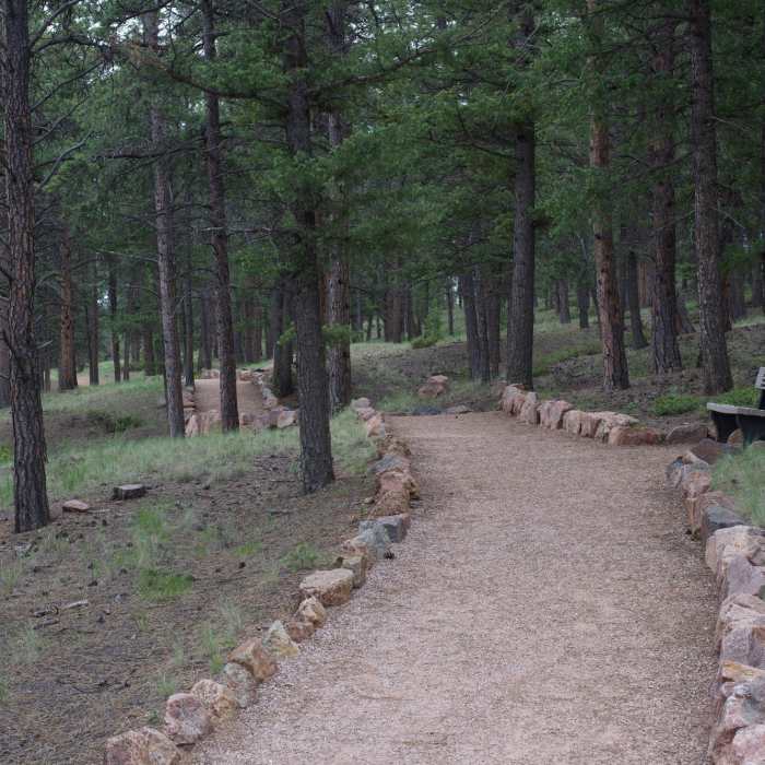 The trail rolls along the hillside above the visitor center. The trail makes its way through the forest, making it nice even on a sunny day. Near Boulder Creek Trail
