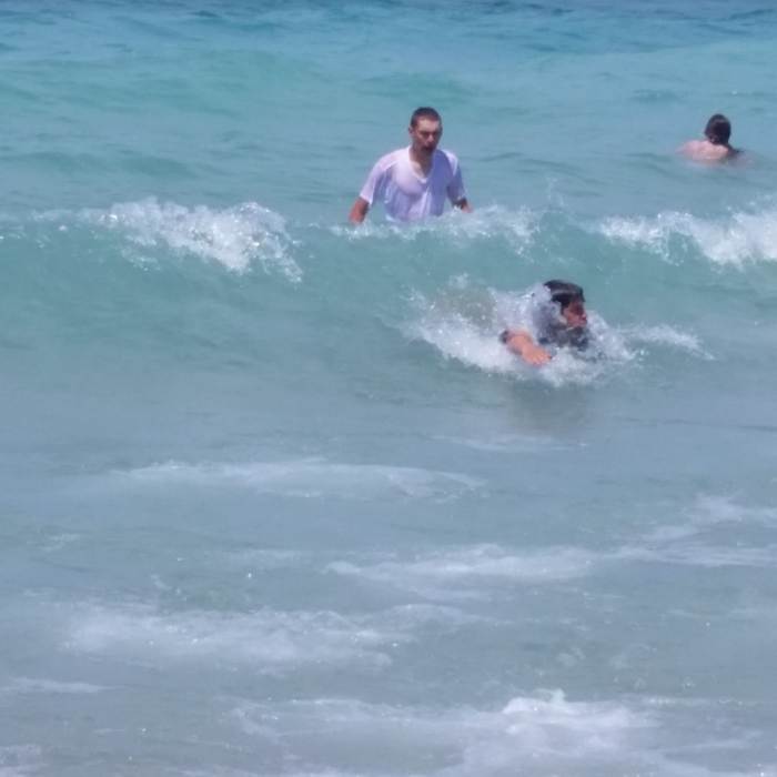 Visitors take a rewarding swim in Lake Michigan. Near Dunes Trail