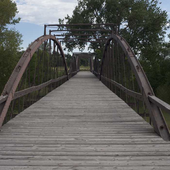 There is wrought iron bridge that crosses the North Platte river at the trailhead that you can walk out on to enjoy views of the river. Near Confluence Trail
