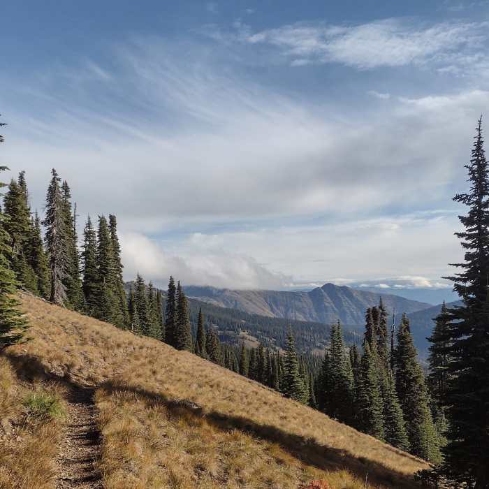 Heading out on Pend Oreille Divide Trail, high on a ridge, mounain views to the northeast give a hint of what's to come. Near Mount Pend Oreille Out-and-Back