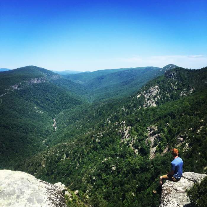 Enjoy a beautiful view of where the gorge carves through the mountains by sitting on one of the cliff edges along the Shortoff Mountain Trail. Near Linville Gorge Wilderness Loop