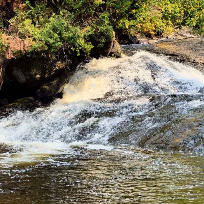 A cascade in the upper river. Near Cascade River Loop