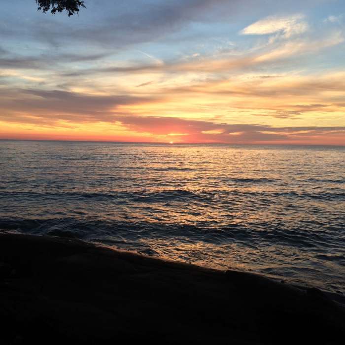 The sun sets over Lake Superior. Near Lake Superior Trail