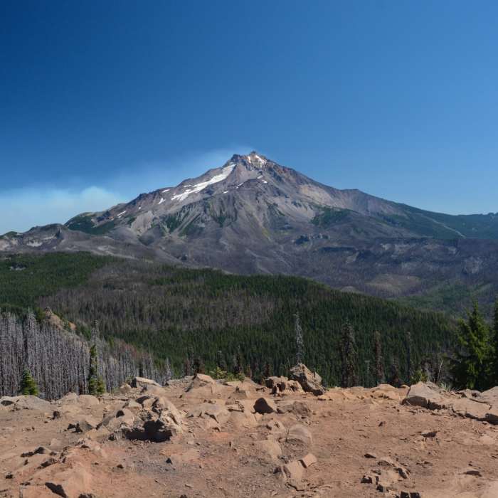 Mount Jefferson from the summit of Triangulation Peak with the fire form the 2020 Lionshead fire behind. Near Boca Cave