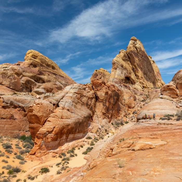 The trail leads up on the right side of the rock fin. Near White Domes Loop
