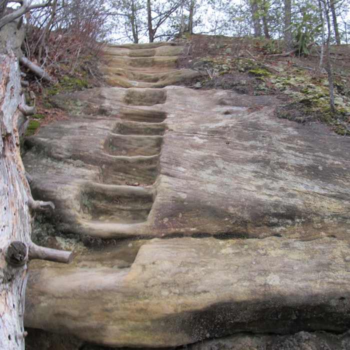 A carved-rock staircase leads to the top of Double Arch. Near Double Arch Trail #201