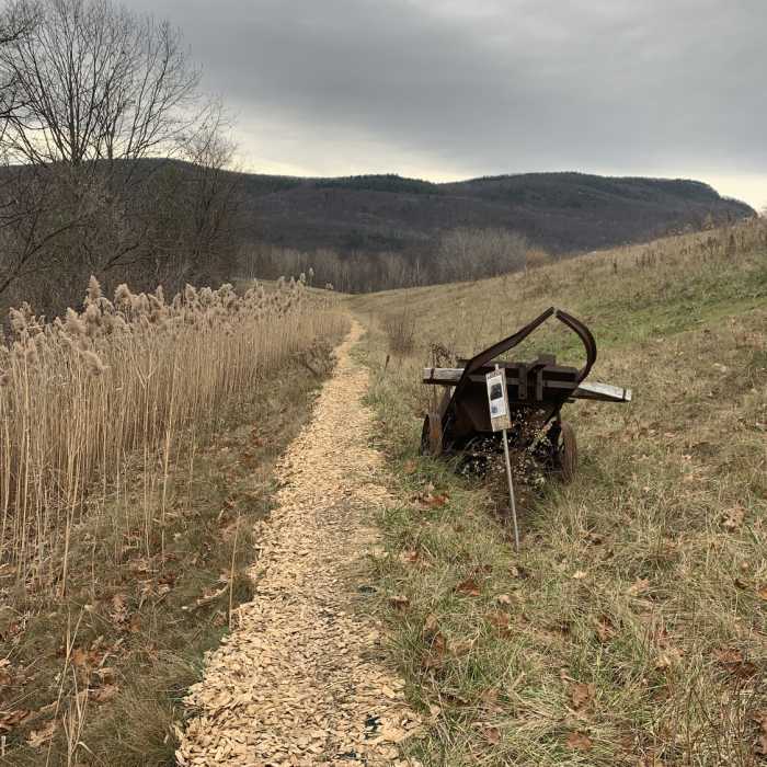 Old Dump Trail with historical information site. Near Village Loop