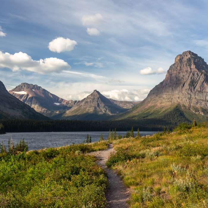 Never Laughs Mountain, Grizzly Mountain, Painted Tepee Peak, and Sinopah Mountain (left to right) with Two Medicine Lake in the front Near Dawson Pass