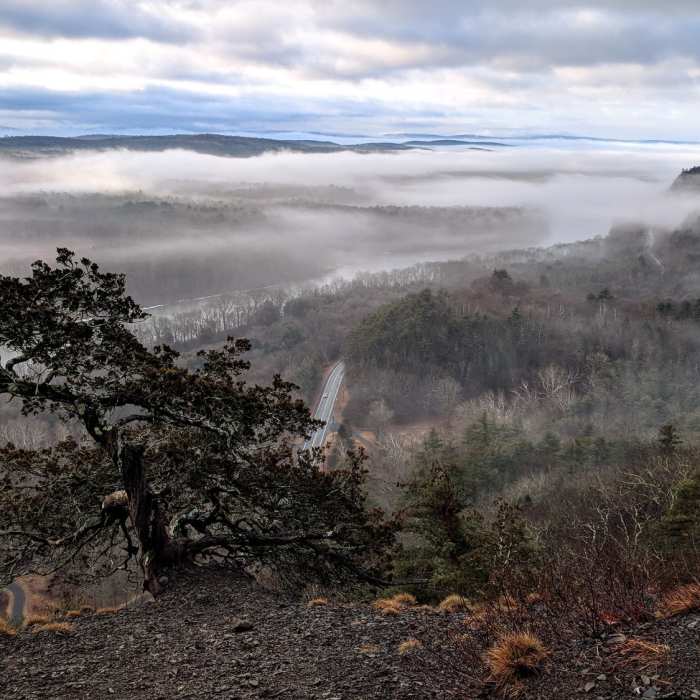 A foggy, late winter morning looking down on the Delaware River and Route 209 from Cliff Park Trail in the Delaware Water Gap National Recreation Area Near Cliff Trail
