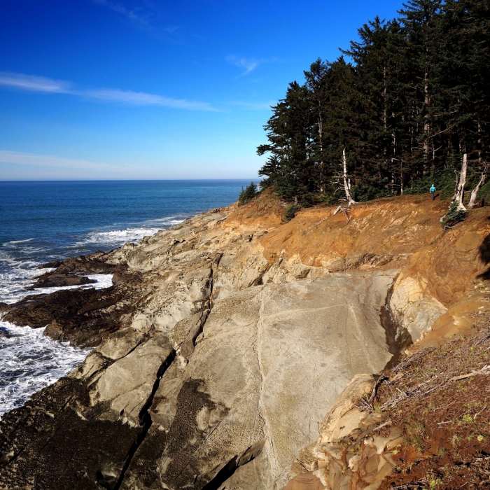 Traversing above the cliffs at Cape Sebastian (blue dot is a person) Near Cape Sebastian