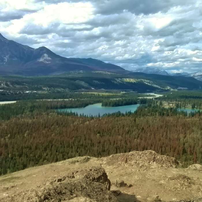 Pyramid Mountain on the left, and Lac Beauvert below (center) as seen when looking north-northwest from the western viewpoint along the Old Fort Point Loop trail. Near Old Fort Point Loop