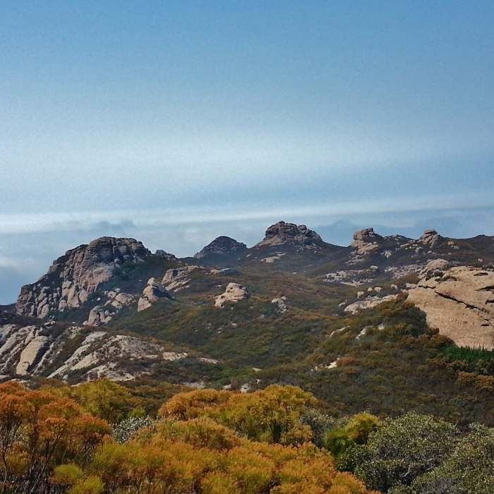 Clouds begin to fill the sky looking north from Sandstone Peak. Near Sandstone Peak Loop