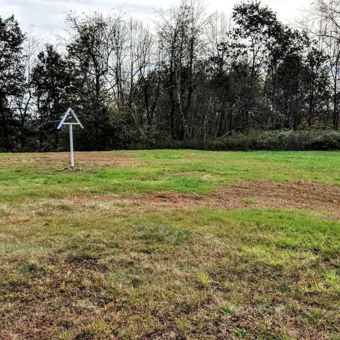 The well renowned AT symbol stands proudly on a hill to mark the hikers way at a particularly ambiguous street crossing in Montague, NJ. Near Appalachian Trail to Observation Platform