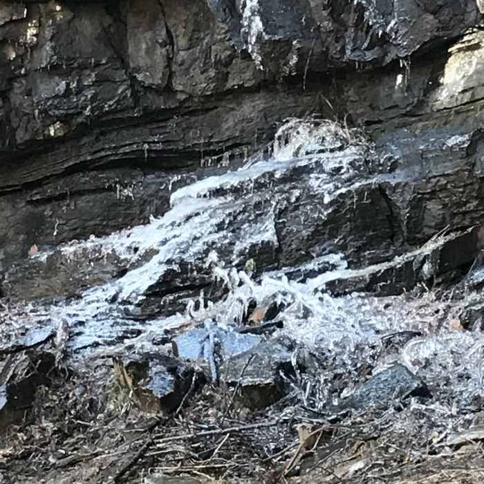 An ice formation provides some wintertime beauty at the bottom of The Cathedral. Near Raven Cliff Falls Loop